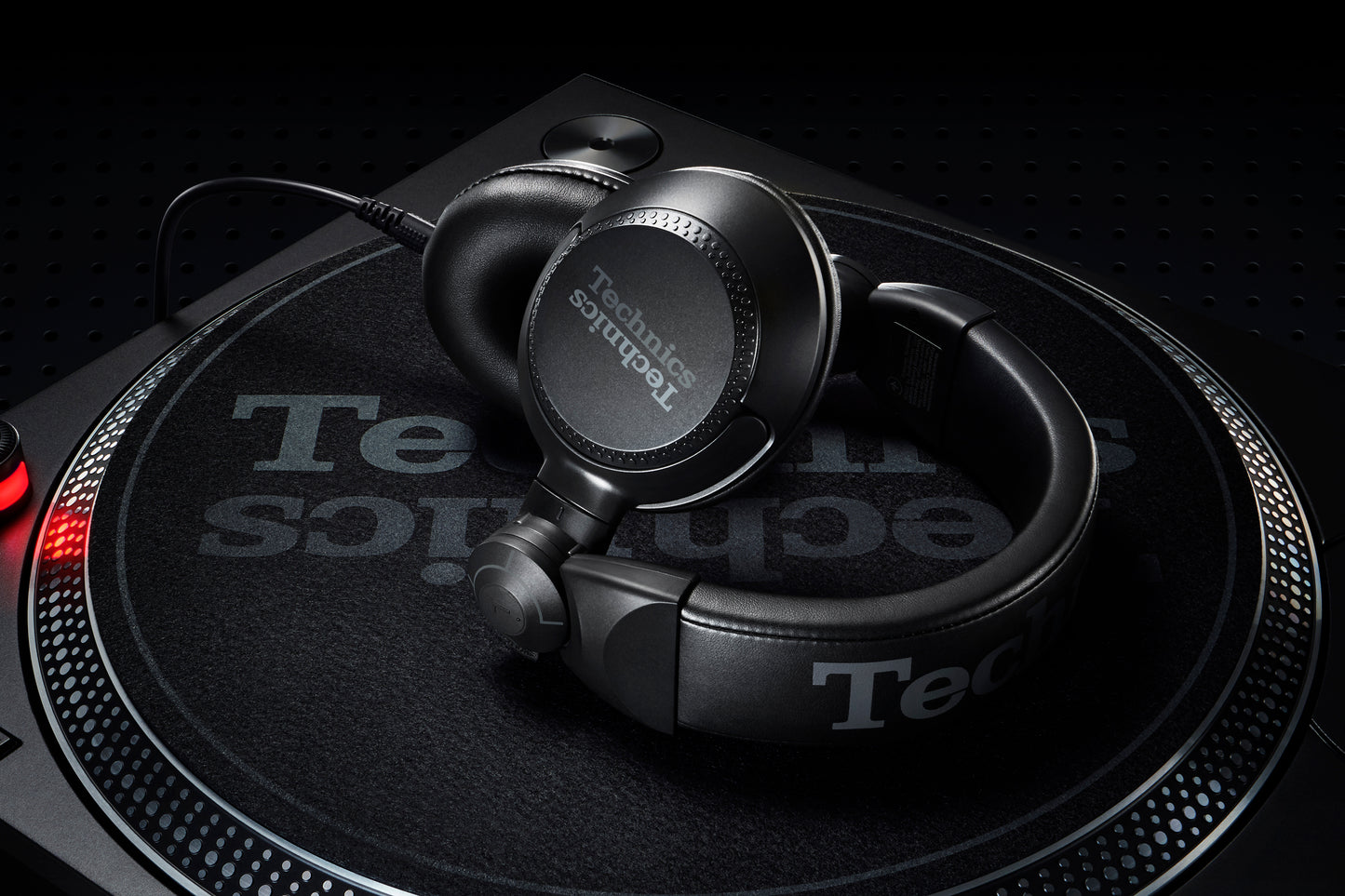 Technics EAH-DJ1200 headphones paired with a Technics SL-1200MK7 turntable for a complete DJ setup.